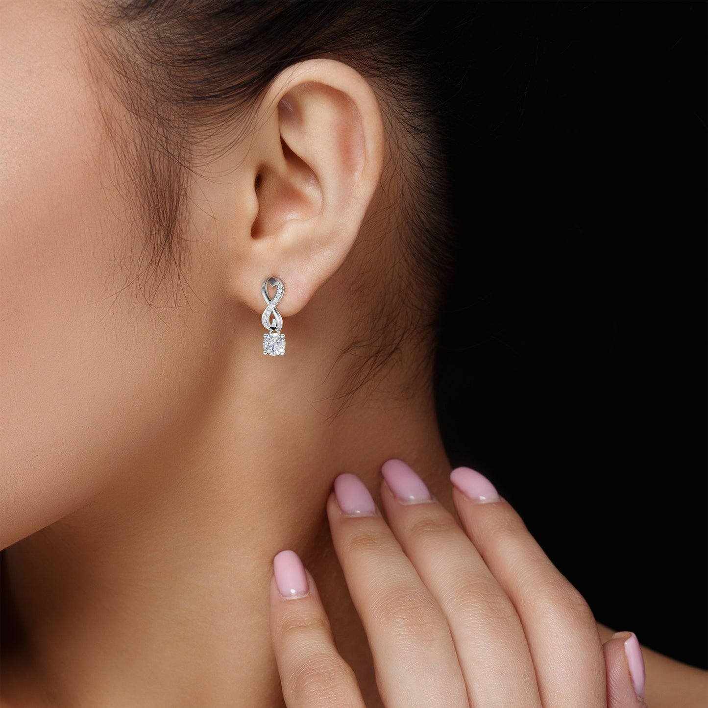 Close-up of Infinity Embrace Diamond Earrings in 18K white gold, detailing the brilliance of 2.18 ct lab-grown round brilliant diamonds and infinity craftsmanship.