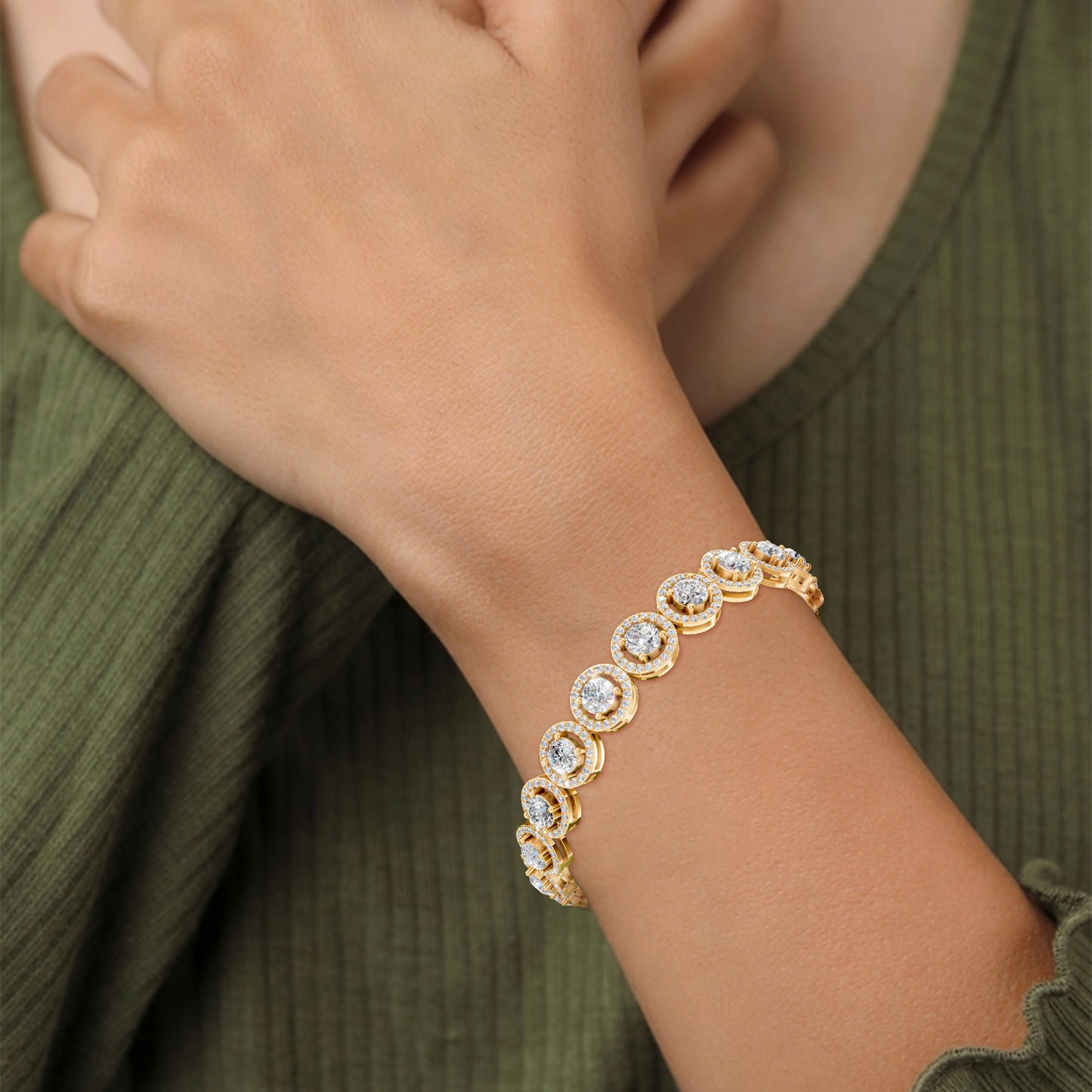 Worn on the wrist, the bracelet glows with vintage elegance, the 8.50 CT of halo-set diamonds sparkling against warm yellow gold.