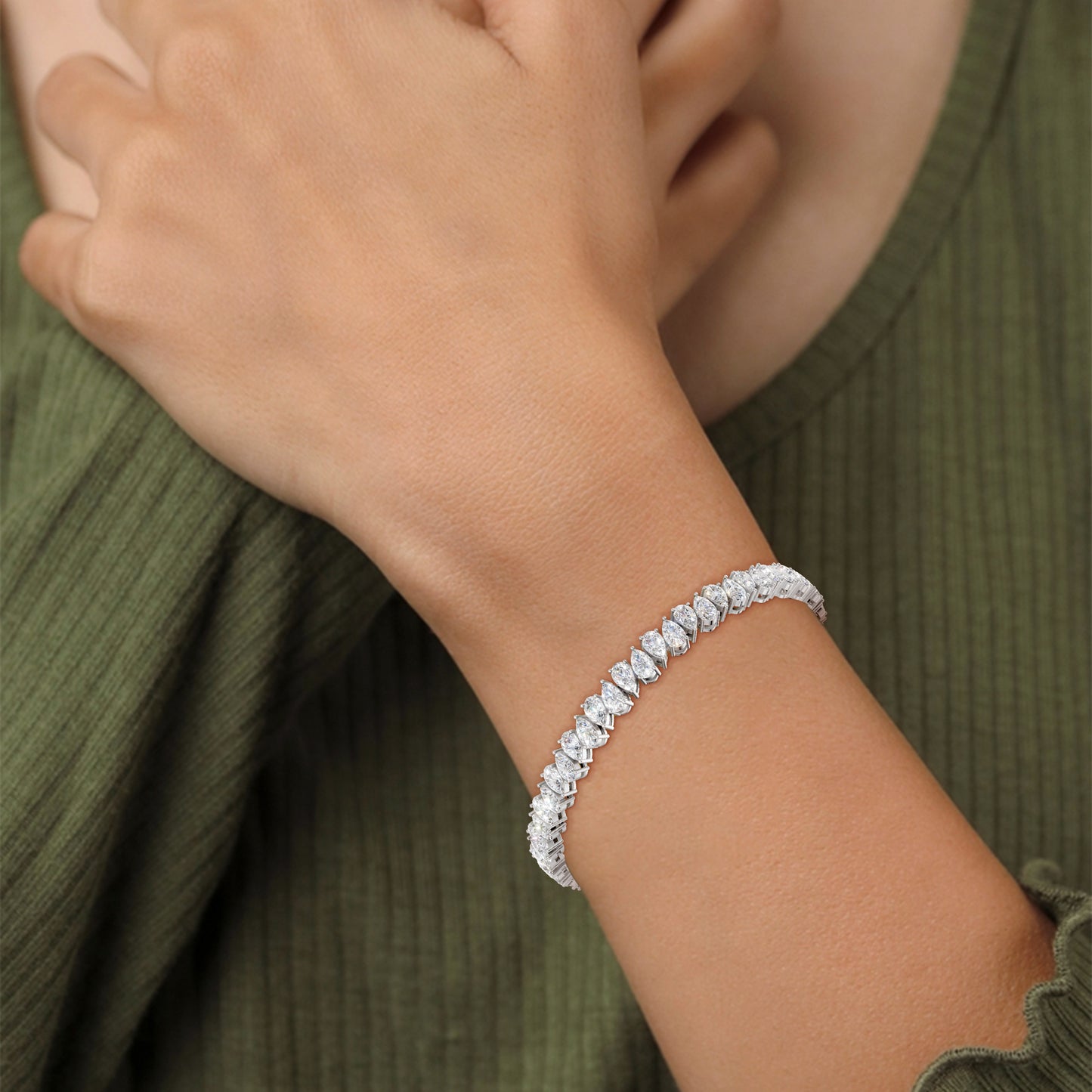 Close-up of the Pear Radiance Bracelet on a model, detailing the 7.95 ct pear-cut diamonds’ brilliance and the polished 18K white gold setting, highlighting the signature sparkle.