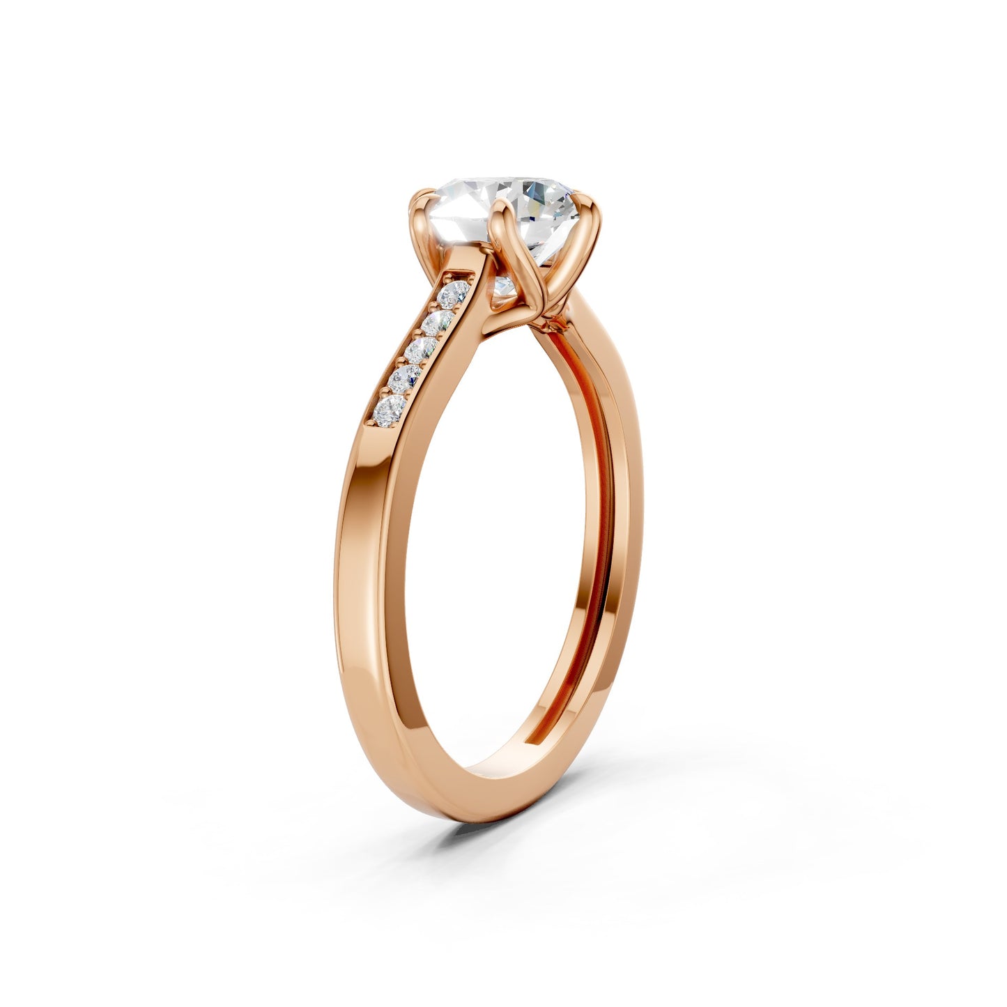 Top-down view revealing the symmetrical trio of diamonds and the gentle blush of the rose gold setting.