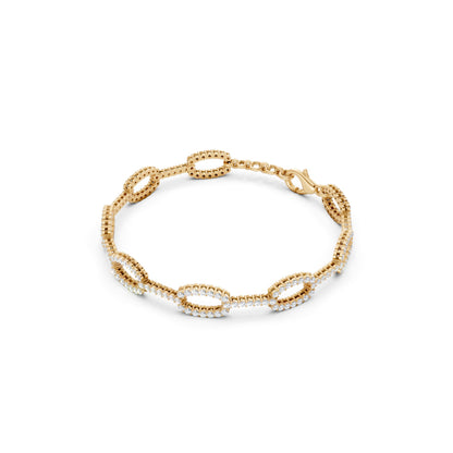 Sculptural profile emphasizing the bracelet’s substantial yellow gold link structure and encrusted diamond surfaces.