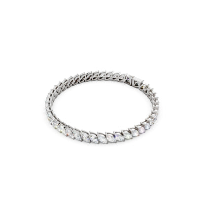 Profile shot highlighting the slender setting and fluid line of marquise stones encased in gleaming white gold.