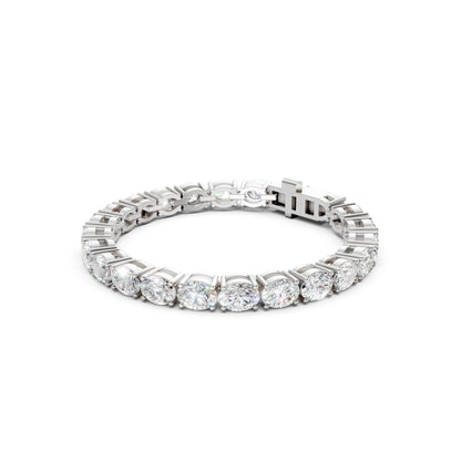 Sleek profile displaying white gold prongs and elongated oval stones.