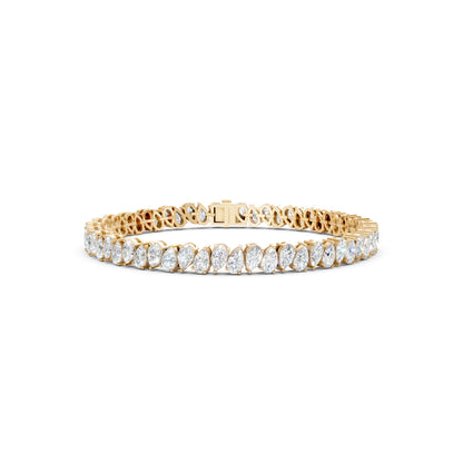 Front view of the Pear Radiance Bracelet, highlighting 7.95 ct pear-cut diamonds arranged in 18K yellow gold, emphasizing the bracelet’s radiant sparkle and intricate craftsmanship.