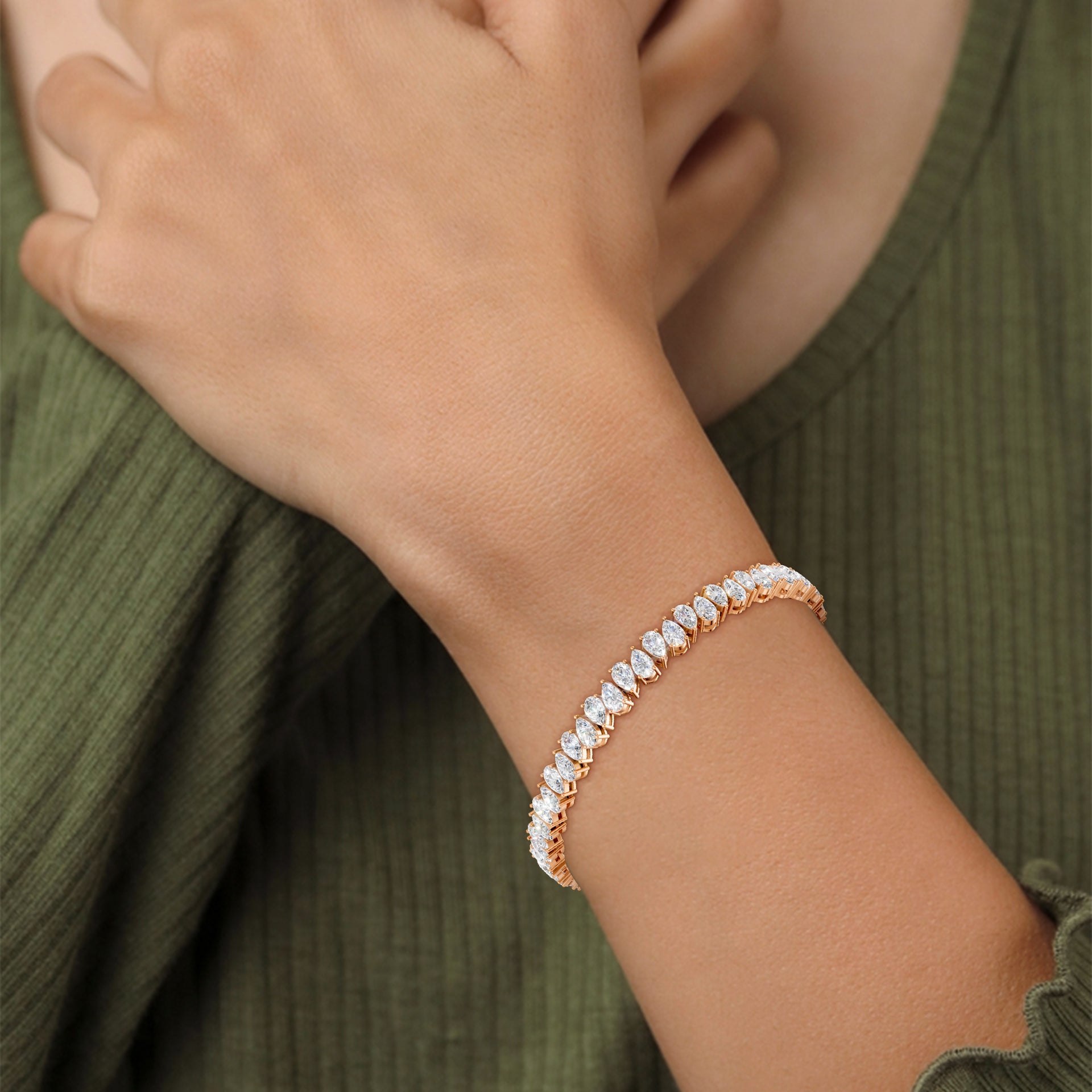 Close-up of the Pear Radiance Bracelet on a model, detailing the 7.95 ct pear-cut diamonds’ brilliance and the polished 18K rose gold setting, highlighting the signature sparkle.