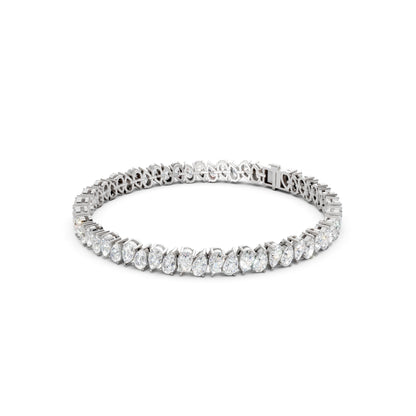 Side view of the Pear Radiance Bracelet, displaying the sleek profile of 7.95 ct pear-cut diamonds set in 18K white gold, showcasing the bracelet’s elegant curvature.
