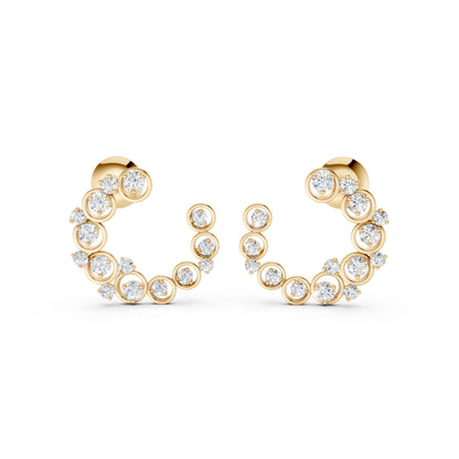 Elegant frontal capture of Halo Arc earrings in yellow gold, adorned with 32 prong- and bezel-set lab-grown diamonds totaling 0.57 CT.