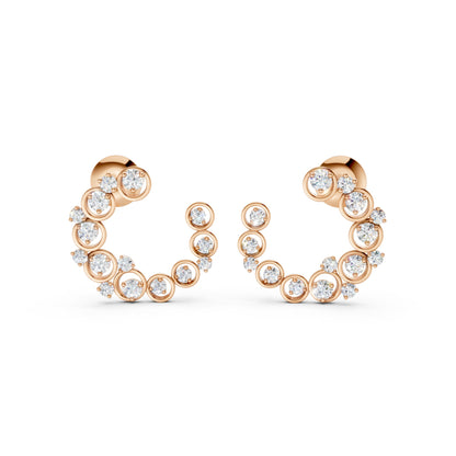 Elegant frontal capture of Halo Arc earrings in rose gold, adorned with 32 prong- and bezel-set lab-grown diamonds totaling 0.57 CT.
