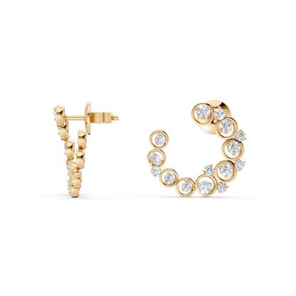 The pair displayed in harmony, showing the full curvature and polished glow of yellow gold.