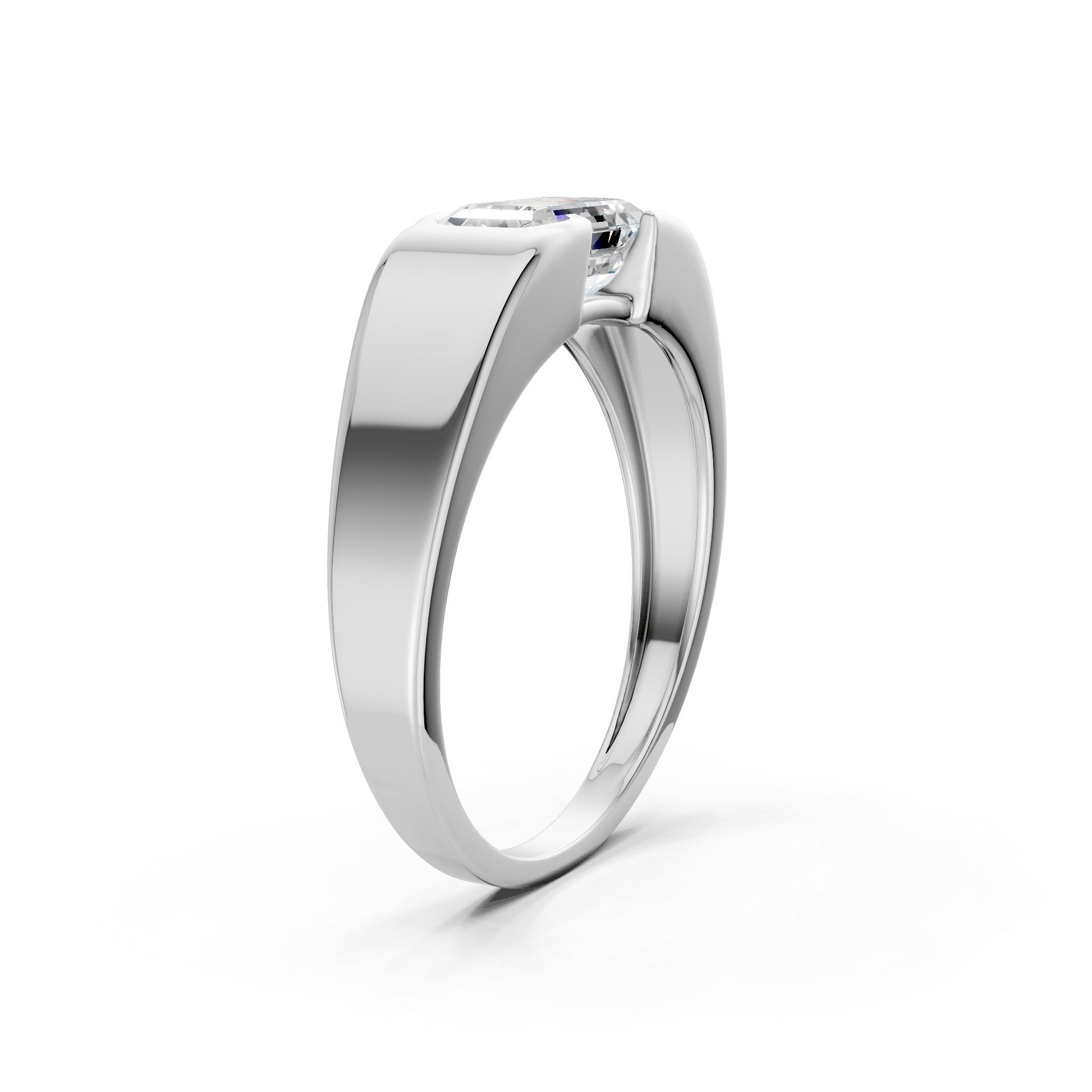 Top-down composition displaying the elongated emerald shape paired with a modern white gold silhouette.