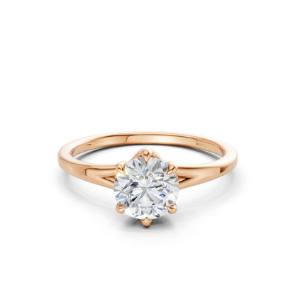 Frontal view of the Radiant Solitaire 1.0 CT Diamond Ring in rose gold, showcasing a brilliantly faceted radiant-cut diamond glowing against a soft, romantic blush-toned band.