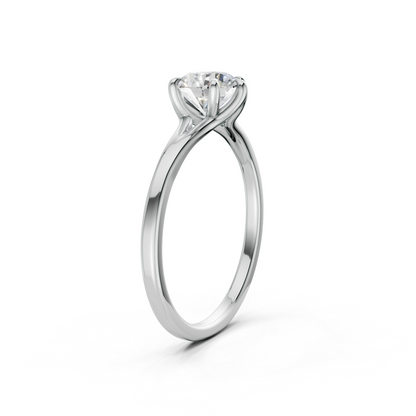 Flat-lay view presenting the clean, rectangular facets of the diamond and the high-shine finish of white gold.