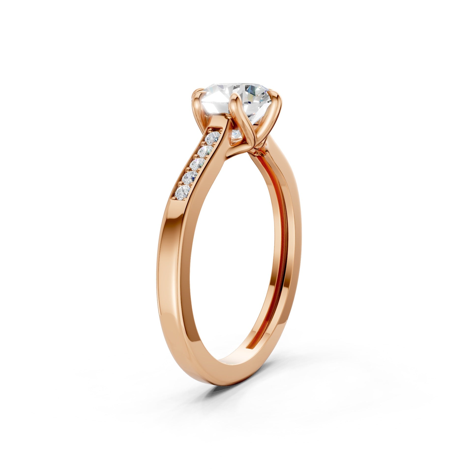Top-down view revealing the symmetrical trio of diamonds and the gentle blush of the rose gold setting.