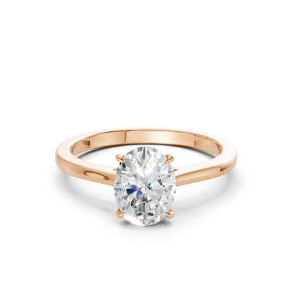 Frontal view of the Oval Radiance 1.5 CT Diamond Ring in rose gold, showcasing a brilliant oval-cut center diamond flanked by side stones, all set in a romantic rose hue.
