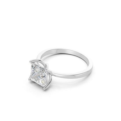 Detailed side angle revealing the structured basket setting and smooth white gold band.