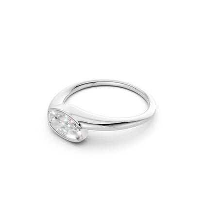 Side profile of the ring in white gold, showcasing the lifted mount and the sleek, modern elegance of its streamlined band.