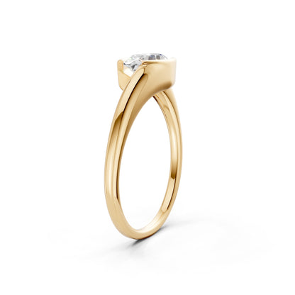 Top-down composition of the yellow gold ring, capturing the balance between the oval diamond and rich golden tones.