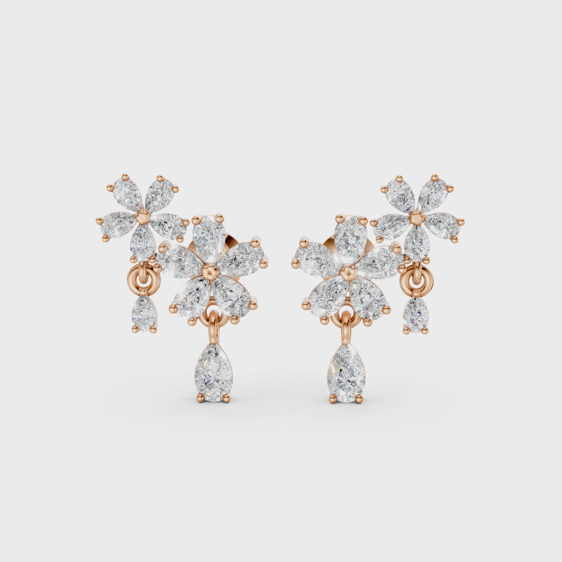 Short video of Floral Cascade Diamond Earrings in 18K rose gold, featuring 3.20 ct lab-grown diamonds, rotating to showcase the warm hue and sparkling layered blossom design.