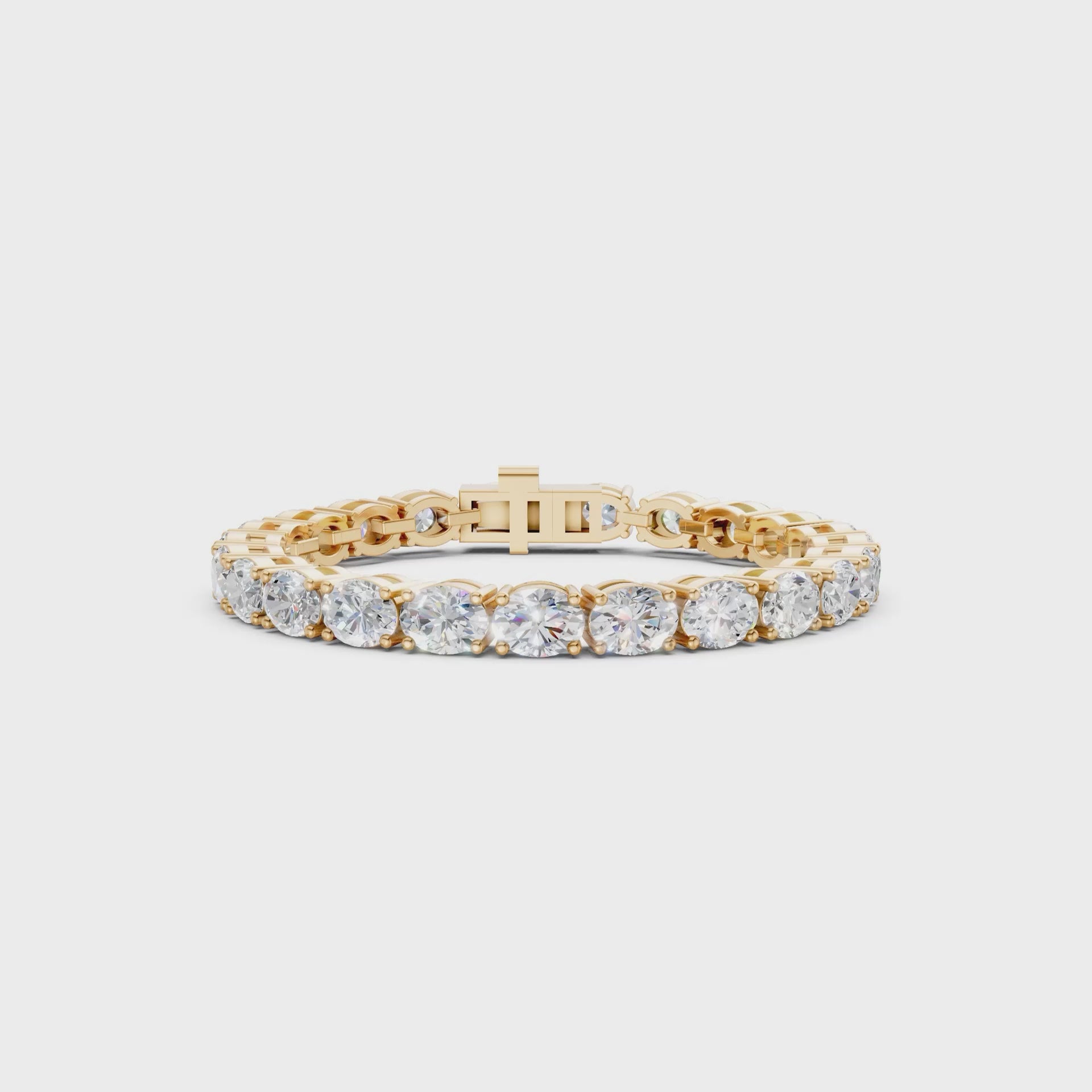 Rotating clip capturing diamond sparkle and yellow gold’s luminous finish.