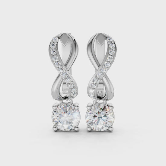Short video of Infinity Embrace Diamond Earrings in 18K white gold, featuring 2.18 ct lab-grown diamonds, rotating to showcase the cool hue and sparkling infinity motif.