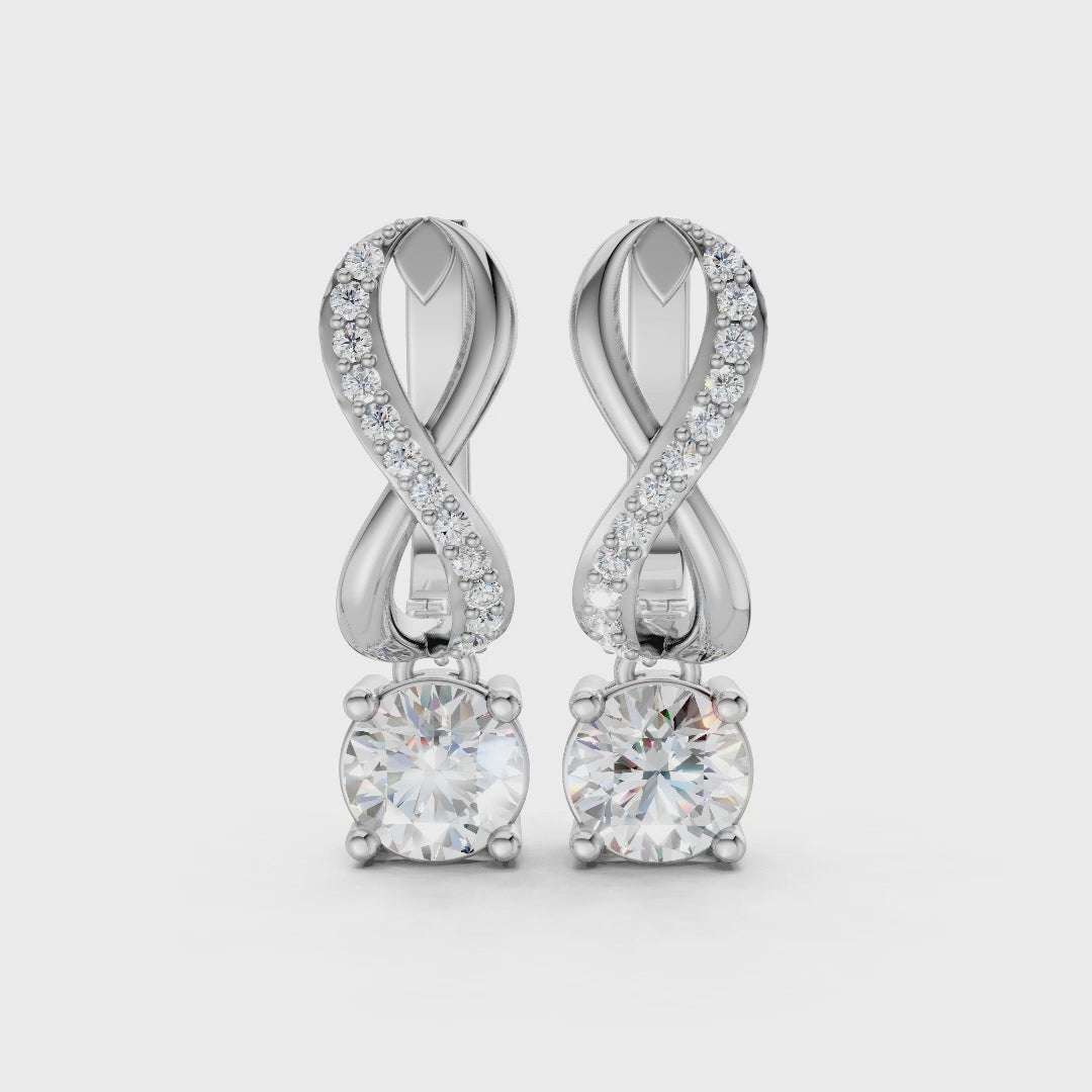 Short video of Infinity Embrace Diamond Earrings in 18K white gold, featuring 2.18 ct lab-grown diamonds, rotating to showcase the cool hue and sparkling infinity motif.