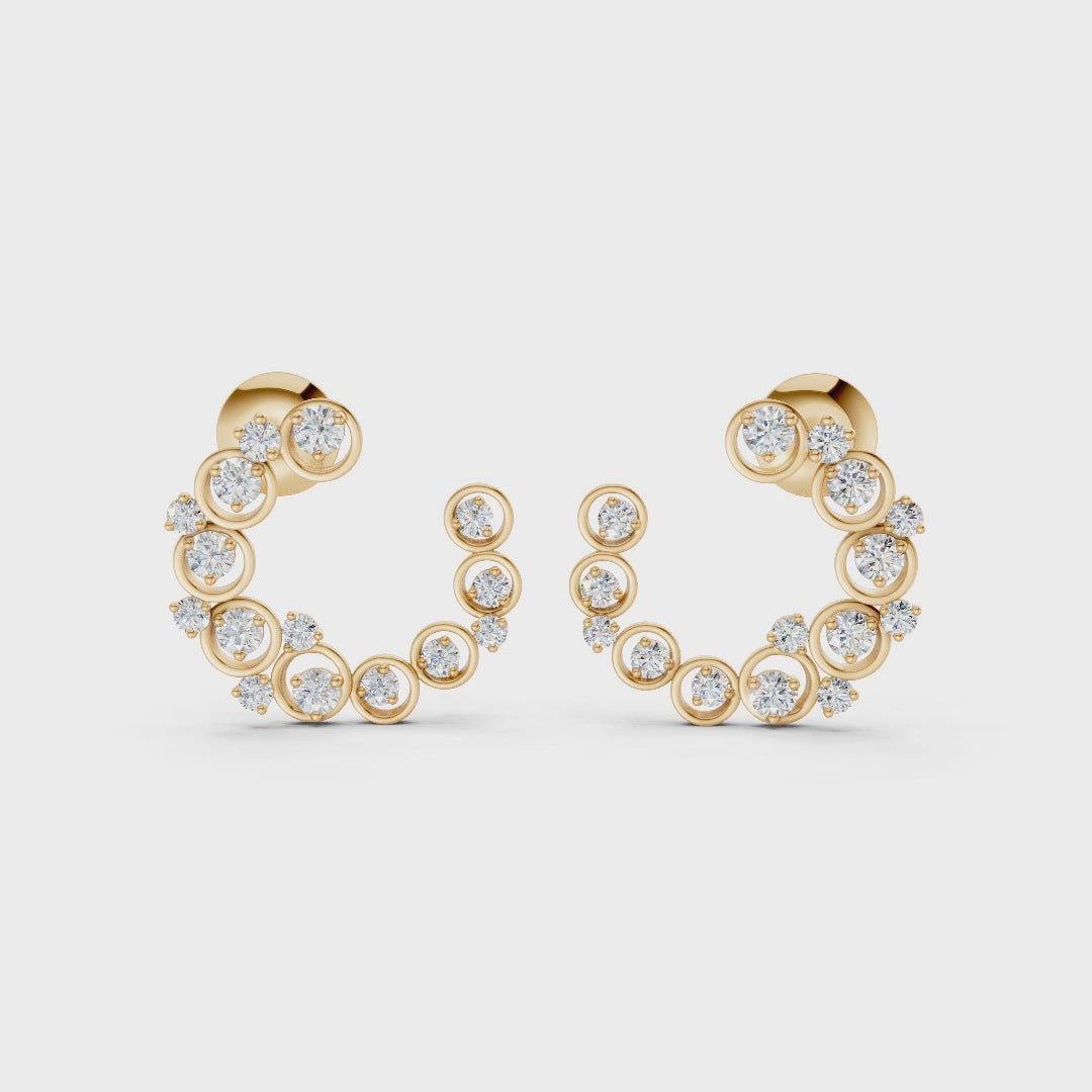 Graceful slow-motion spin highlighting the earrings’ dimensional curve, shimmering stones, and golden luster.