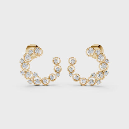 Graceful slow-motion spin highlighting the earrings’ dimensional curve, shimmering stones, and golden luster.