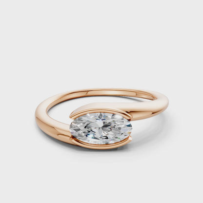 360° rotating video of the Oval Embrace ring in rose gold, capturing the interplay of light and the soft blush tone of the gold.