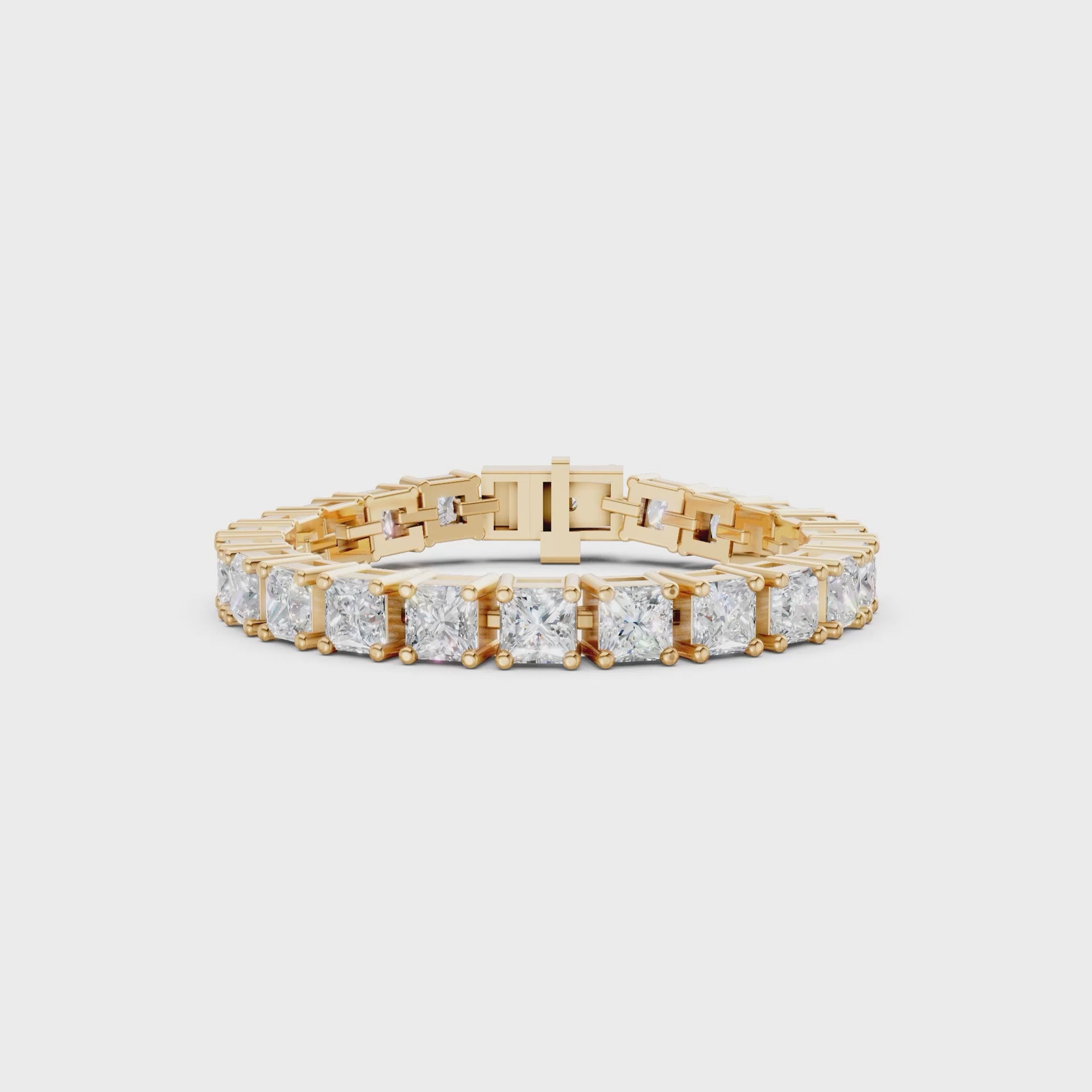 Dynamic rotation showing the interplay of light between the princess-cut diamonds and the reflective gold surface.