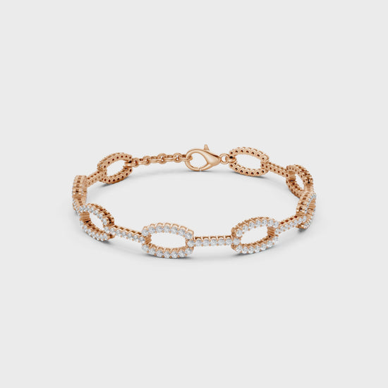 Dynamic video view revealing every facet of rose gold links and diamonds in a dance of light and motion.
