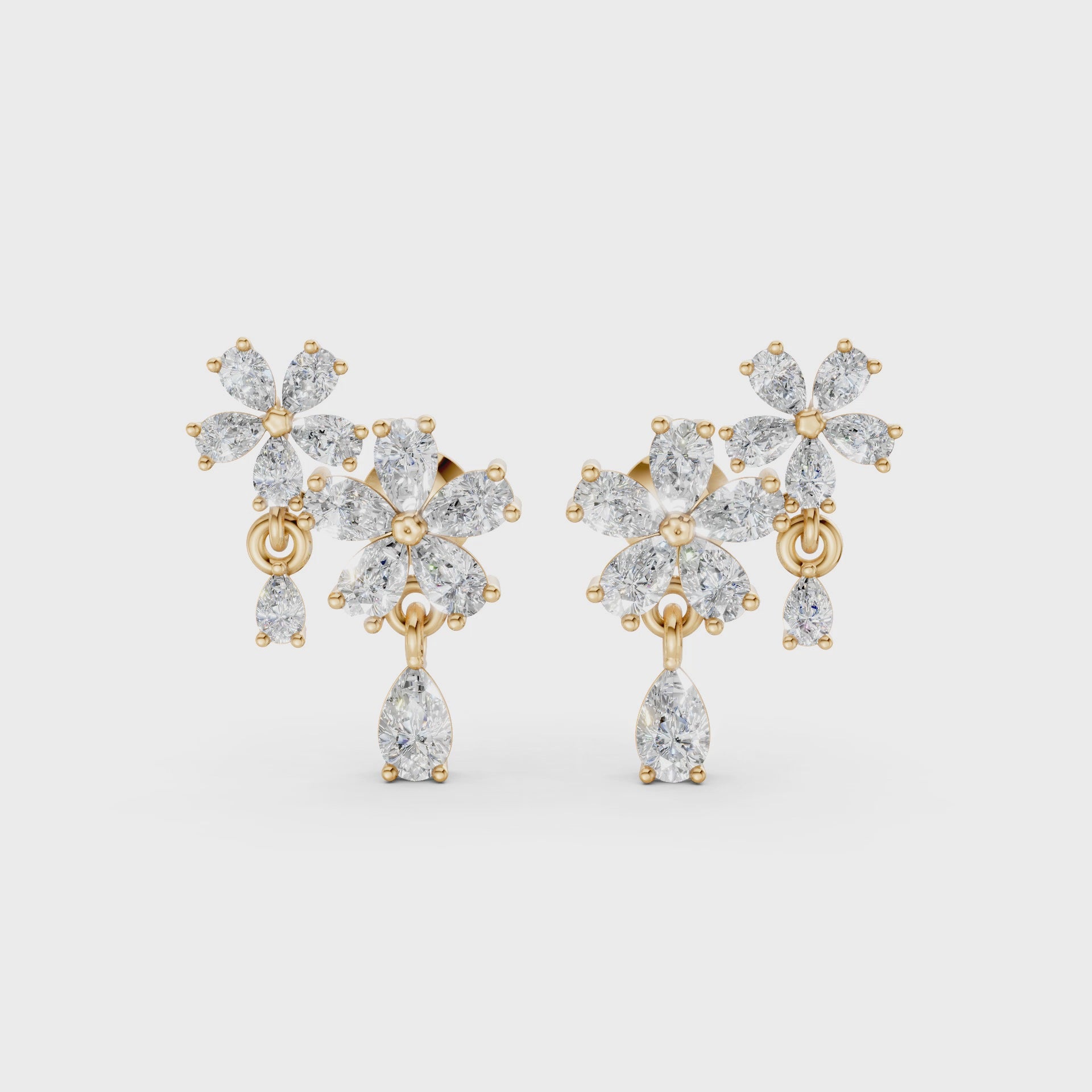 Short video of Floral Cascade Diamond Earrings in 18K yellow gold, featuring 3.20 ct lab-grown diamonds, rotating to showcase the rich hue and sparkling layered blossom design.