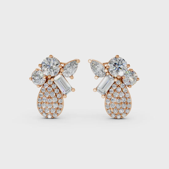 Short video of Modern Teardrop Cluster Diamond Earrings in 18K rose gold, featuring 2.368 ct lab-grown diamonds, rotating to showcase the warm hue and sparkling teardrop cluster.