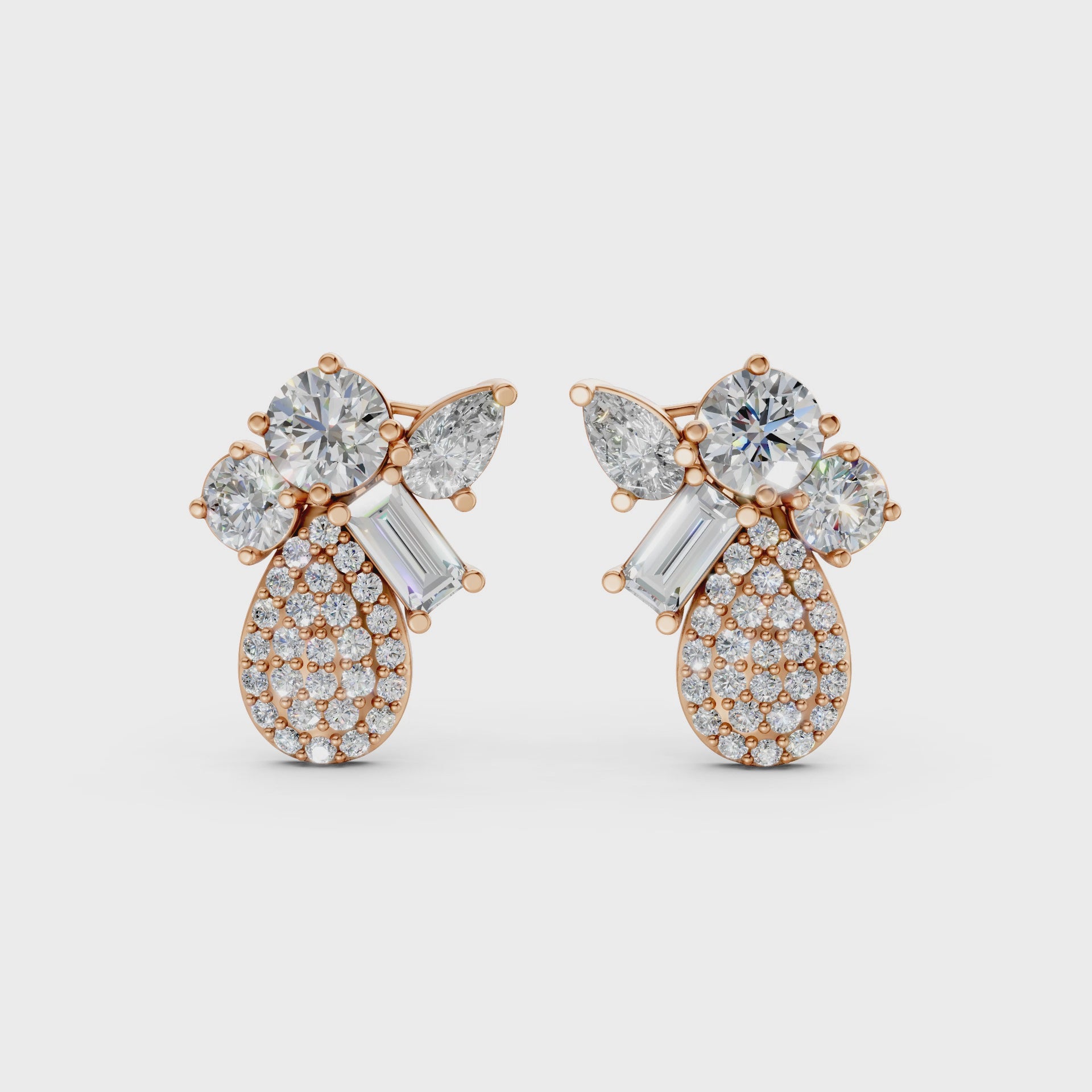 Short video of Modern Teardrop Cluster Diamond Earrings in 18K rose gold, featuring 2.368 ct lab-grown diamonds, rotating to showcase the warm hue and sparkling teardrop cluster.