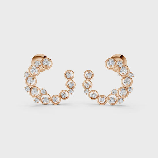 Graceful slow-motion spin highlighting the earrings’ dimensional curve, shimmering stones, and rich rose gold tones.