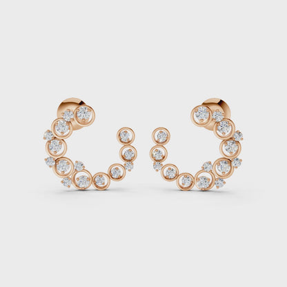 Graceful slow-motion spin highlighting the earrings’ dimensional curve, shimmering stones, and rich rose gold tones.
