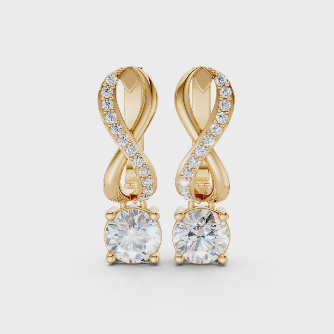 Short video of Infinity Embrace Diamond Earrings in 18K yellow gold, featuring 2.18 ct lab-grown diamonds, rotating to showcase the rich hue and sparkling infinity motif.