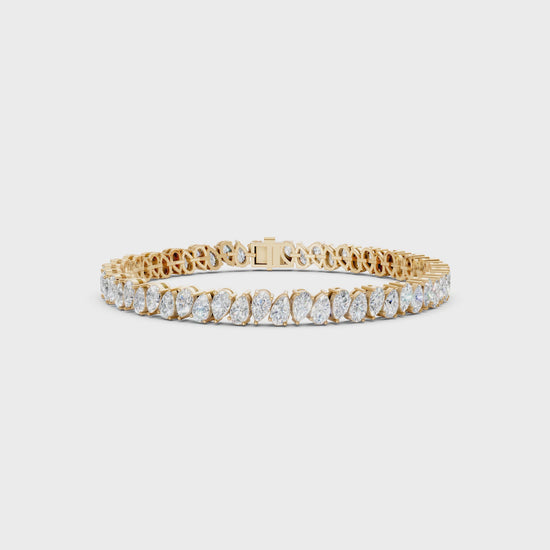 Short video showcasing the Pear Radiance Bracelet, featuring 7.95 ct pear-cut diamonds in 18K yellow gold, rotating to display its sparkling design and luxurious craftsmanship.