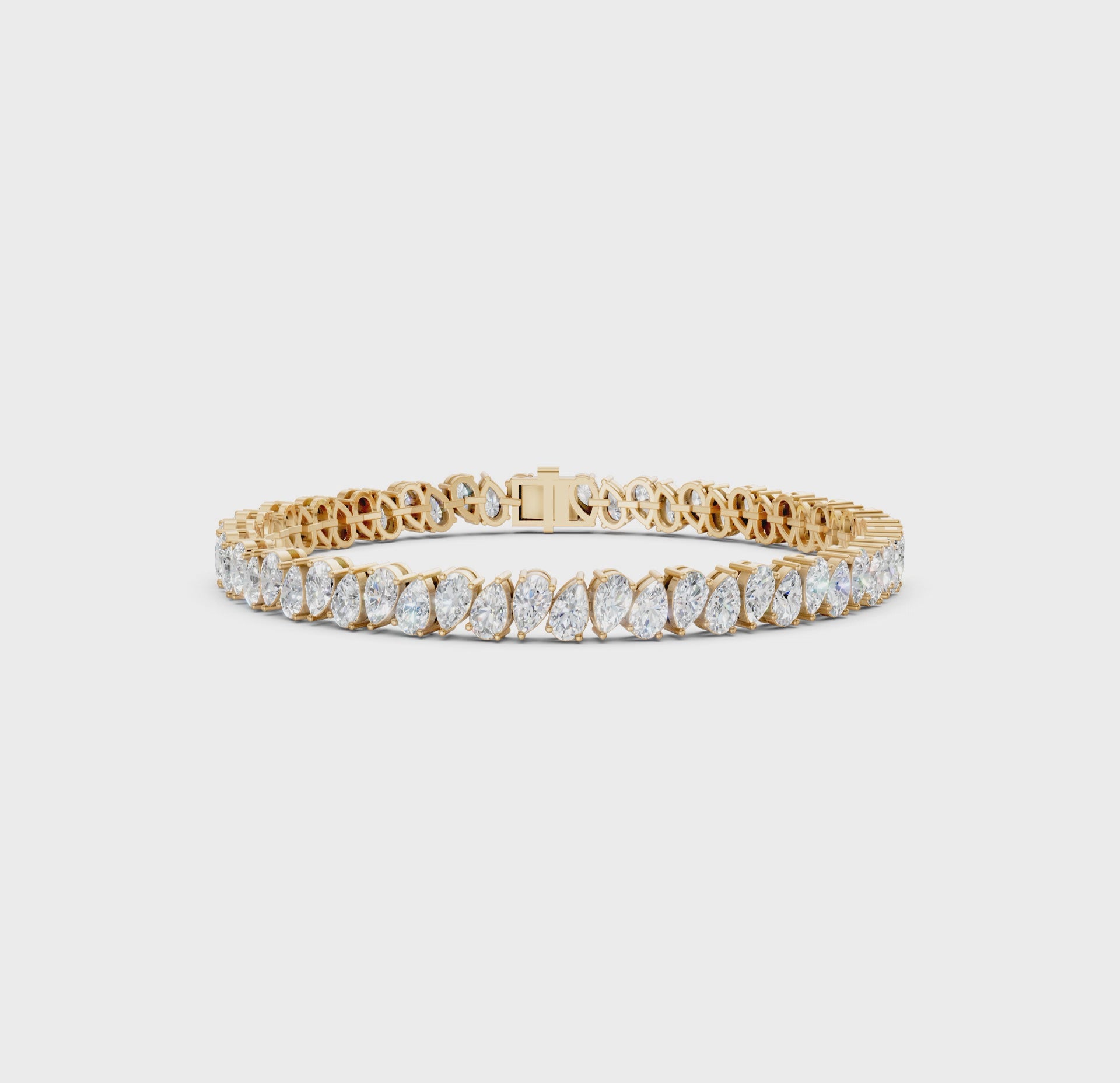Short video showcasing the Pear Radiance Bracelet, featuring 7.95 ct pear-cut diamonds in 18K yellow gold, rotating to display its sparkling design and luxurious craftsmanship.