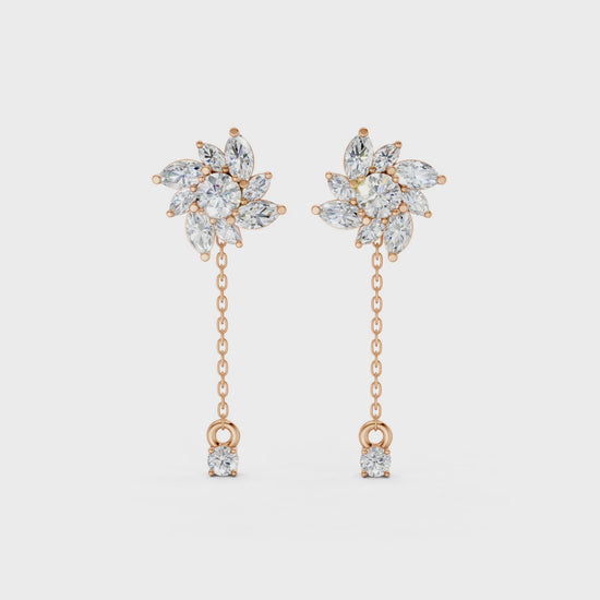 Short video of Floral Drop Earrings in 18K rose gold, featuring 1.85 ct petal-shaped diamonds, rotating to showcase the warm rose gold and sparkling floral design.