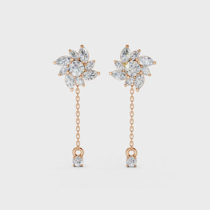 Short video of Floral Drop Earrings in 18K rose gold, featuring 1.85 ct petal-shaped diamonds, rotating to showcase the warm rose gold and sparkling floral design.