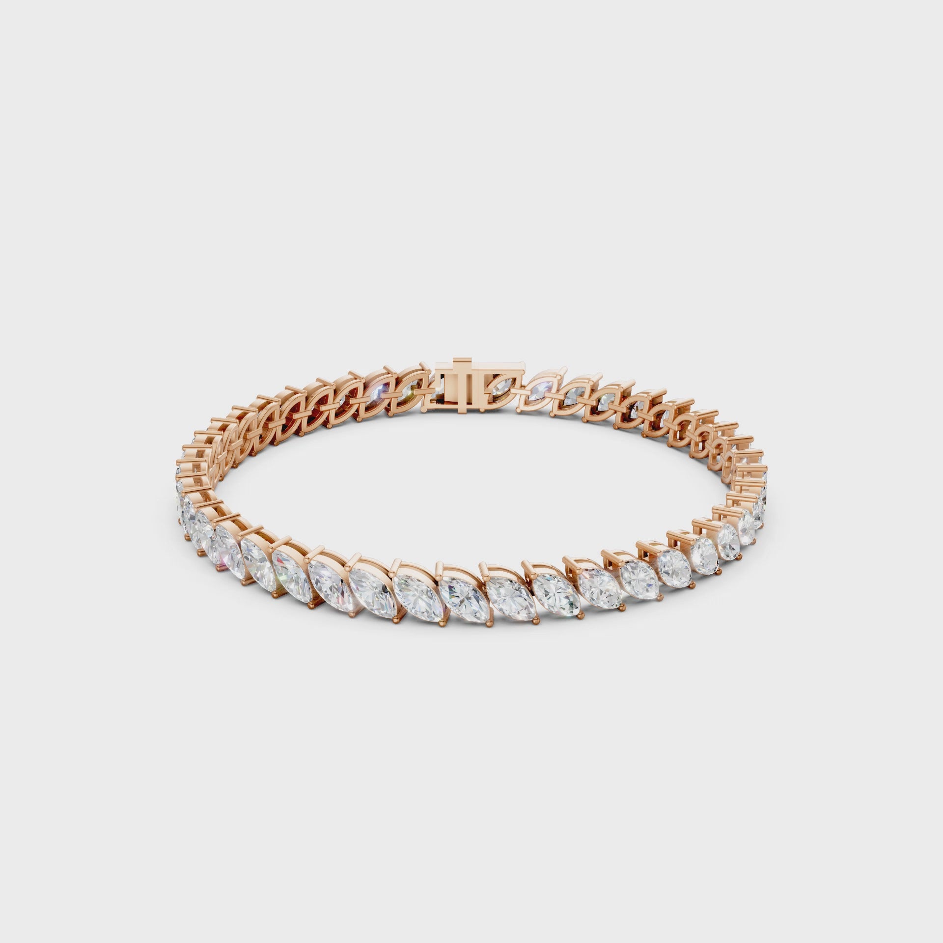 Slow rotating video capturing the light-reflective elegance of marquise facets set within a blushing rose gold framework.