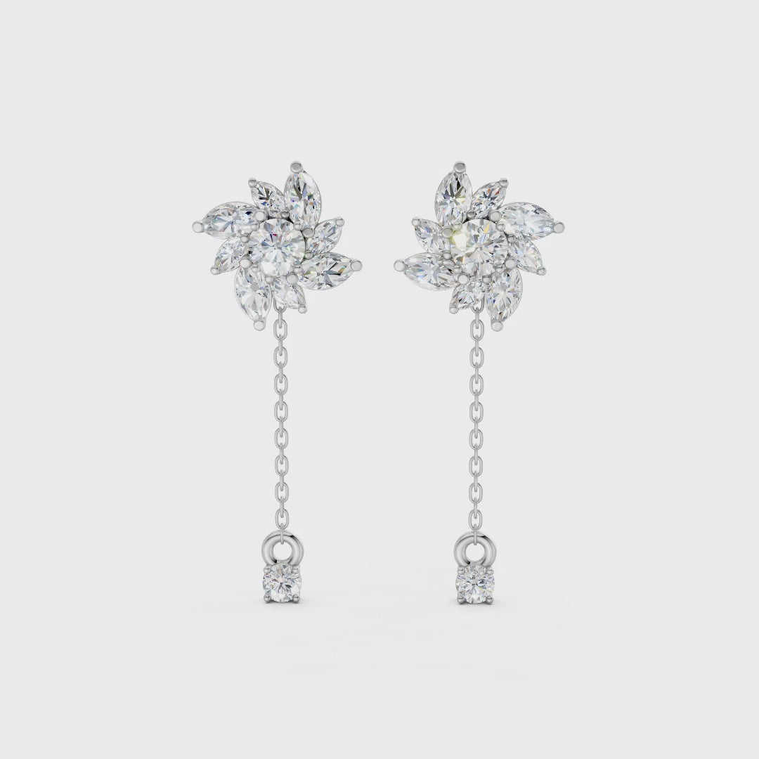 Short video of Floral Drop Earrings in 18K white gold, featuring 1.85 ct petal-shaped diamonds, rotating to showcase the cool white gold and sparkling floral design.