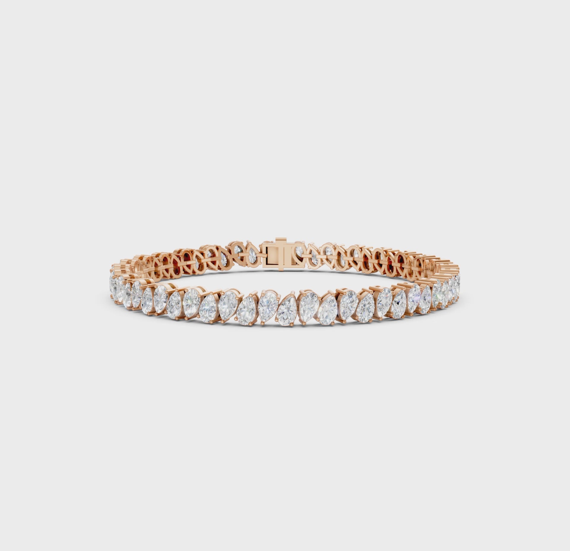 Short video showcasing the Pear Radiance Bracelet, featuring 7.95 ct pear-cut diamonds in 18K rose gold, rotating to display its sparkling design and luxurious craftsmanship.