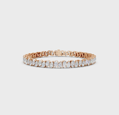 Short video showcasing the Pear Radiance Bracelet, featuring 7.95 ct pear-cut diamonds in 18K rose gold, rotating to display its sparkling design and luxurious craftsmanship.