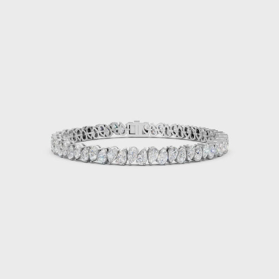 Short video showcasing the Pear Radiance Bracelet, featuring 7.95 ct pear-cut diamonds in 18K white gold, rotating to display its sparkling design and luxurious craftsmanship.