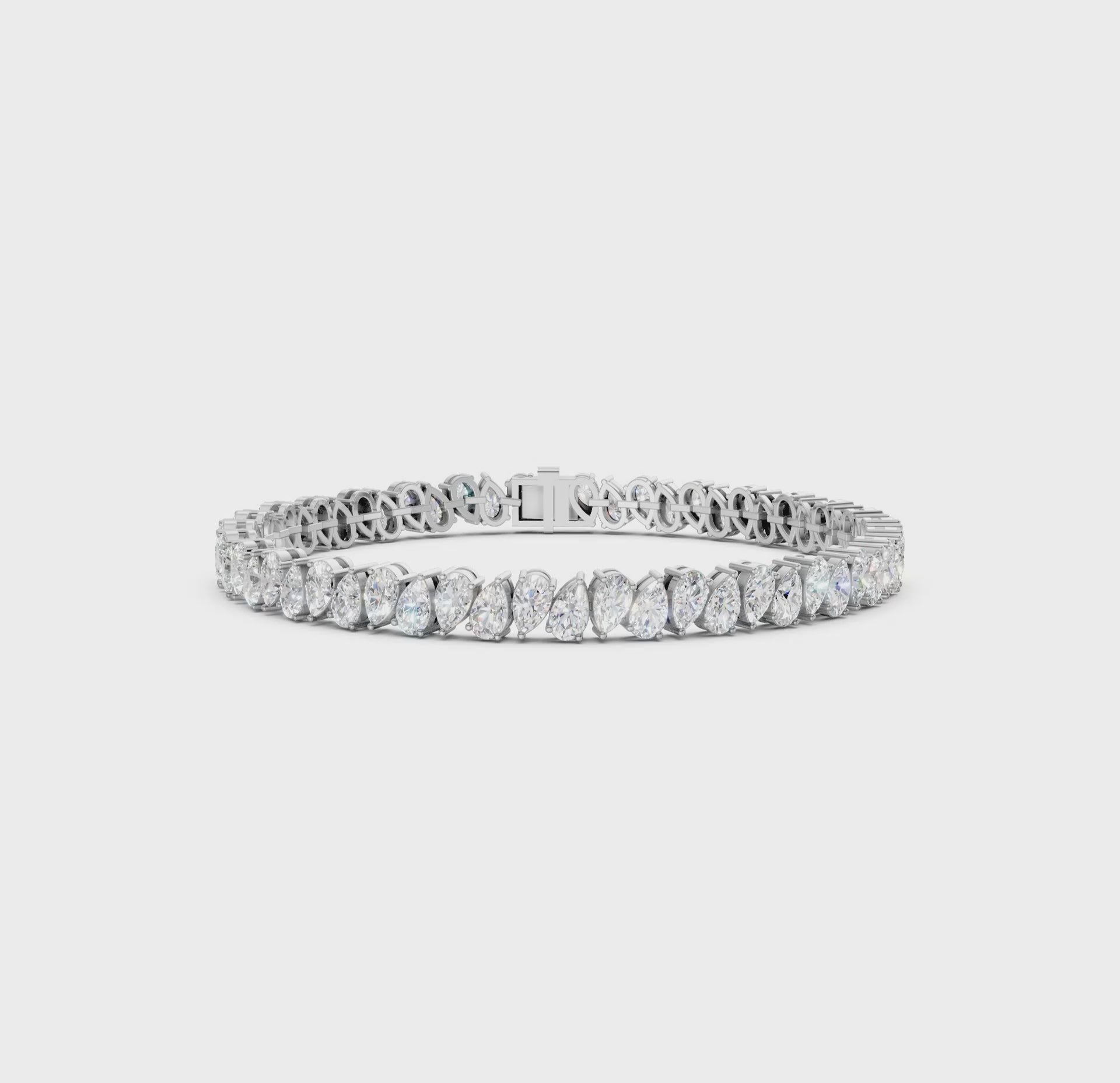Short video showcasing the Pear Radiance Bracelet, featuring 7.95 ct pear-cut diamonds in 18K white gold, rotating to display its sparkling design and luxurious craftsmanship.