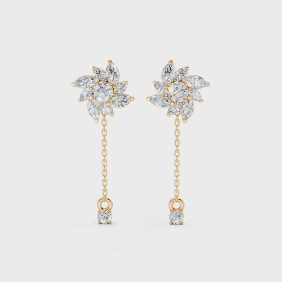 Short video of Floral Drop Earrings in 18K yellow gold, featuring 1.85 ct petal-shaped diamonds, rotating to display the vibrant gold and floral sparkle.