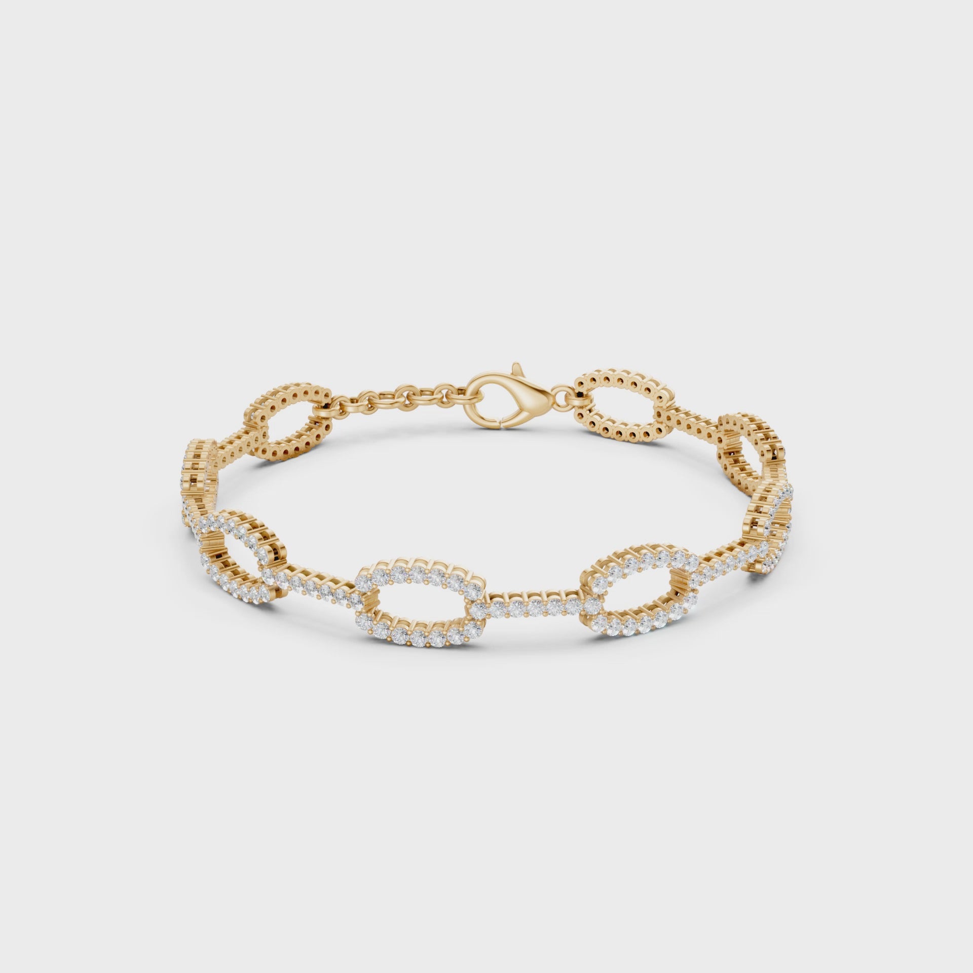 Dynamic video view revealing every facet of yellow gold links and diamonds in a luminous display of craftsmanship.