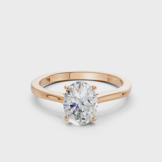 360° rotating video capturing the soft fire of each diamond and the romantic glow of the rose gold band.