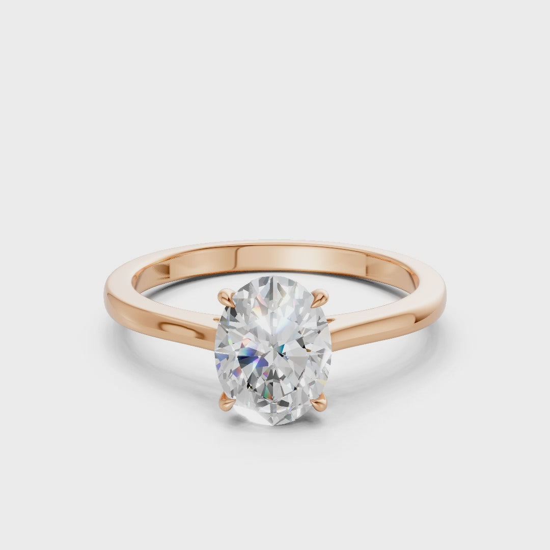 360° rotating video capturing the soft fire of each diamond and the romantic glow of the rose gold band.